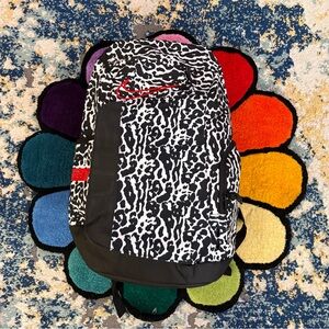 Nike Black and White Patterned Backpack with Red Logo